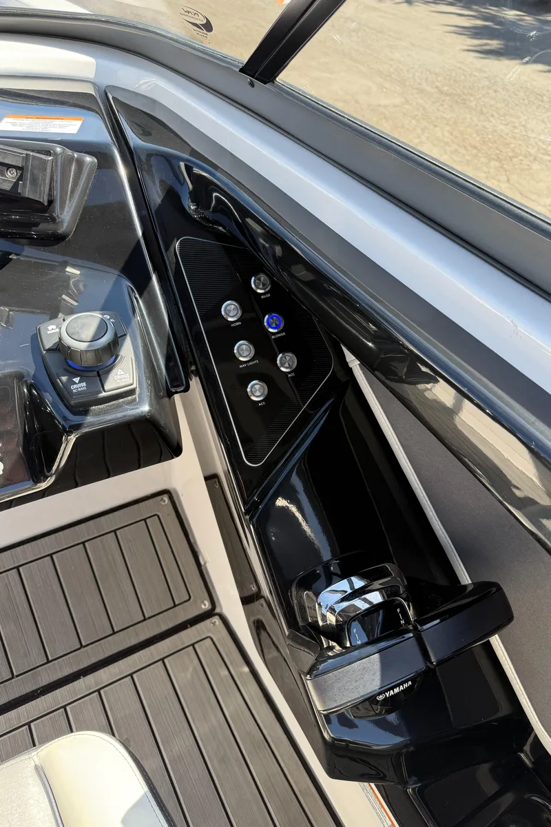 Slide: The Image of 2022 Yamaha Boats 252SD dashboard with modern controls and sleek design. - 18