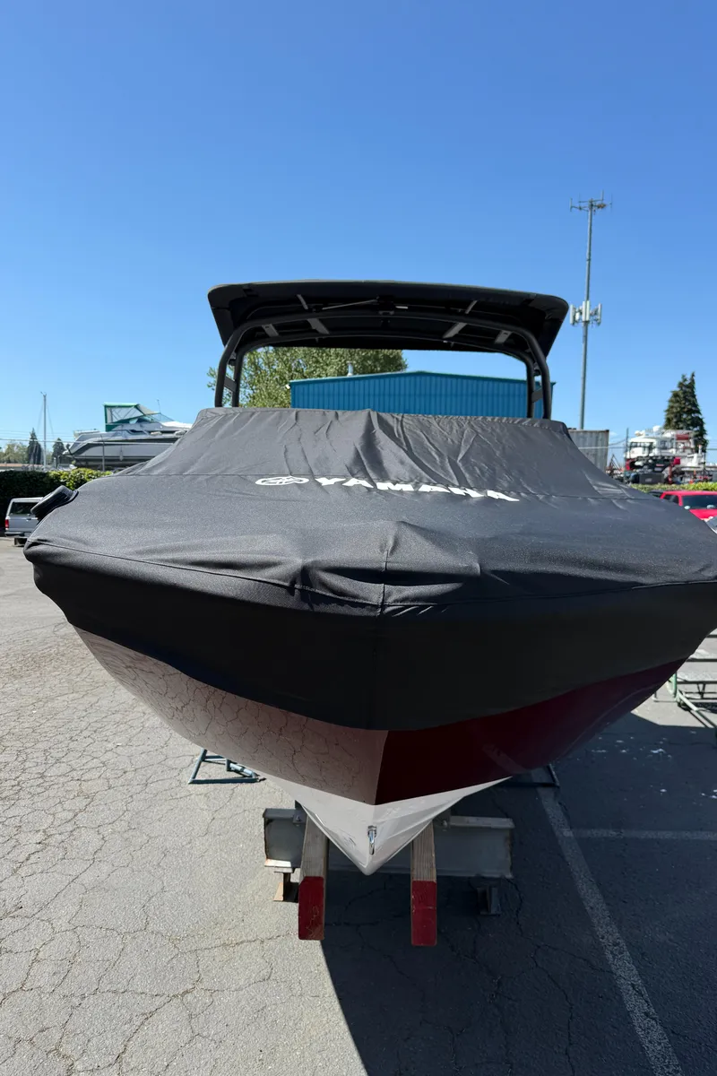 Slide: The Image of 2022 Yamaha Boats 252SD covered and parked outdoors on a sunny day. - 20