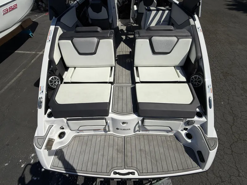 Slide: The Image of 2022 Yamaha Boats 252SD interior with dual seating and sleek design. - 6