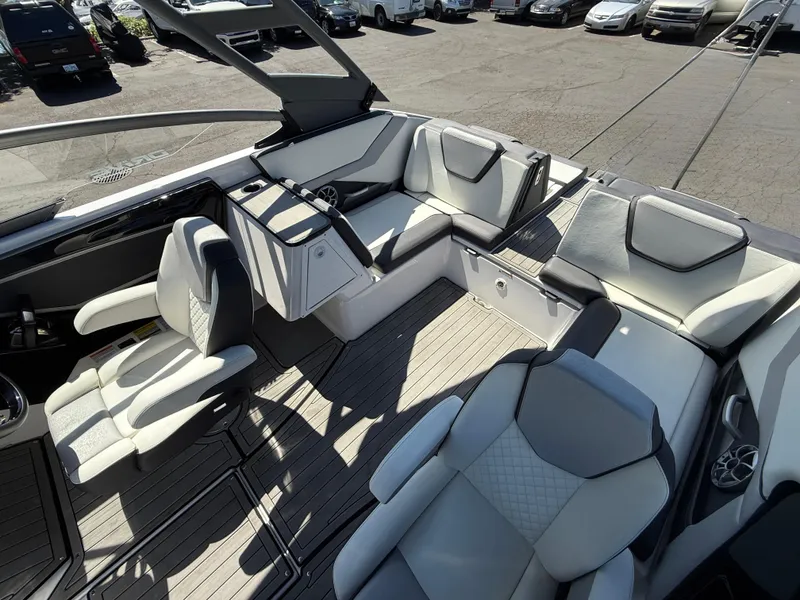 Slide: The Image of 2022 Yamaha Boats 252SD interior with luxurious seating and modern design. - 8