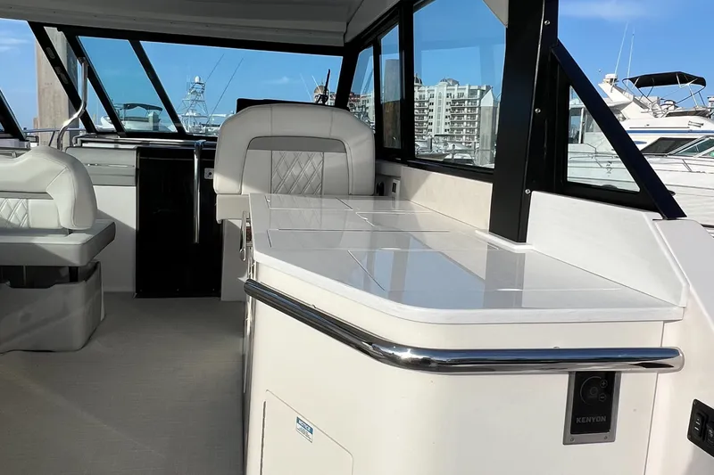 Slide: The Image of Interior of 2021 Regal 36 Grande Coupe yacht with modern seating and sleek design. - 17