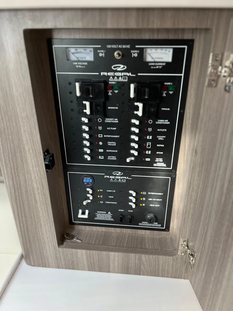 Slide: The Image of Electrical control panel of a 2021 Regal 36 Grande Coupe boat. - 31