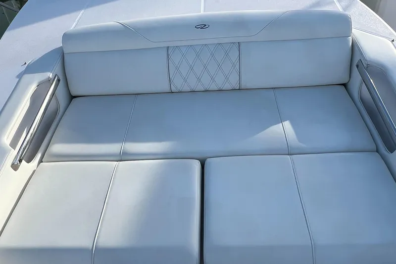 Slide: The Image of 2021 Regal 36 Grande Coupe white leather seating, elegant design, luxury yacht interior. - 35