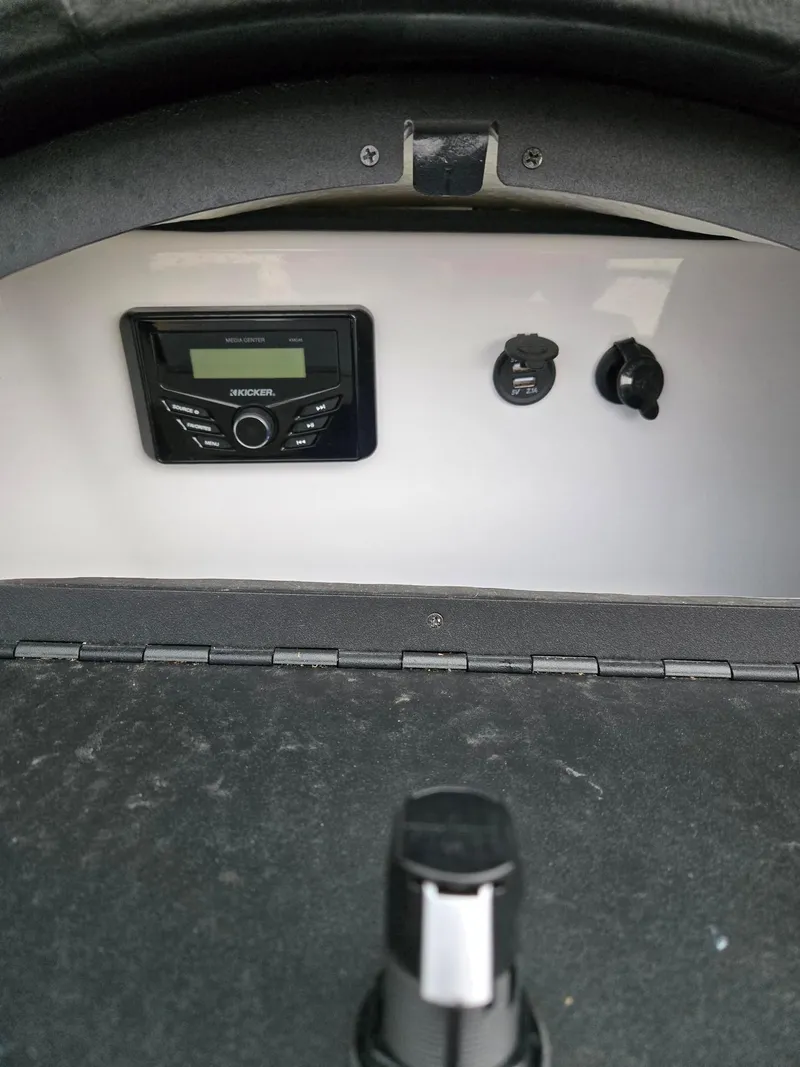 Slide: The Image of 2022 Four Winns HD2 I/O dashboard with Kicker audio system and controls. - 8