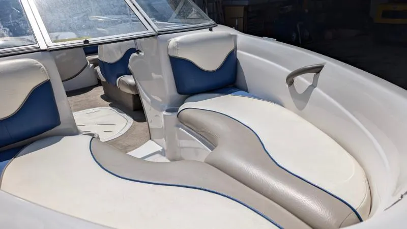 Slide: The Image of 2006 Tahoe Q4 boat interior with white and blue seating. - 3
