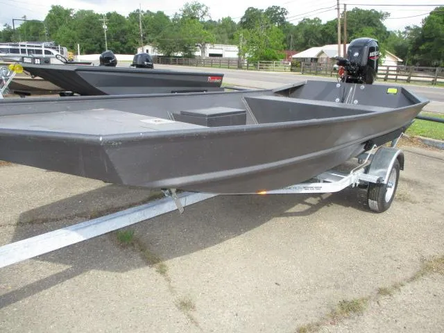Slide: The Image of 2025 Weldcraft 1552 CAJUN TUNNEL boat on trailer, parked outdoors. - 3