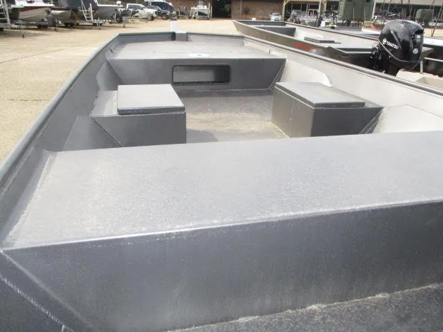 Slide: The Image of 2025 Weldcraft 1552 CAJUN TUNNEL boat interior with seating and storage compartments. - 4