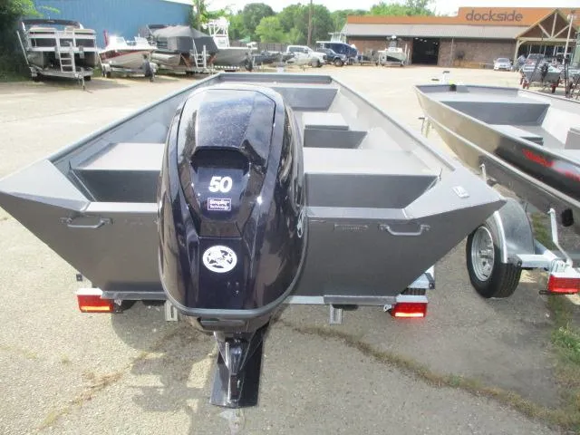 Slide: The Image of 2025 Weldcraft 1548-14219 boat with 50HP outboard motor, parked on a trailer. - 4