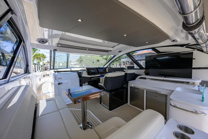 Slide: The Image of 2024 Cruisers Yachts GLS-OB interior with luxurious seating and modern amenities. - 12