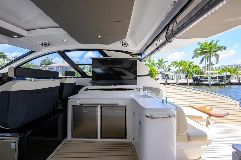 Slide: The Image of 2024 Cruisers Yachts GLS-OB interior with modern amenities and waterfront view. - 13
