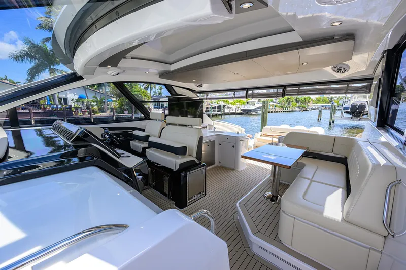 Slide: The Image of Luxurious interior of 2024 Cruisers Yachts GLS-OB with elegant seating and modern design. - 16