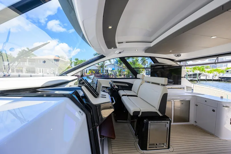 Slide: The Image of 2024 Cruisers Yachts GLS-OB interior with modern helm and luxurious seating. - 18