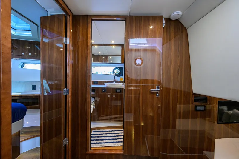 Slide: The Image of Luxurious interior of 2024 Cruisers Yachts GLS-OB with wood paneling and modern design. - 23