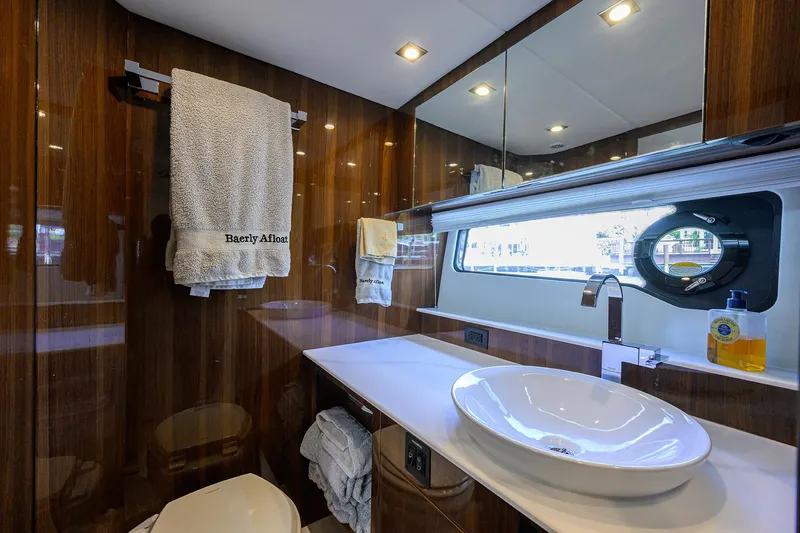 Slide: The Image of Luxurious bathroom in 2024 Cruisers Yachts GLS-OB with modern fixtures and elegant design. - 28