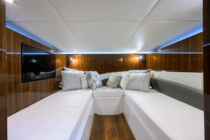 Slide: The Image of 2024 Cruisers Yachts GLS-OB interior with plush seating and modern design. - 30