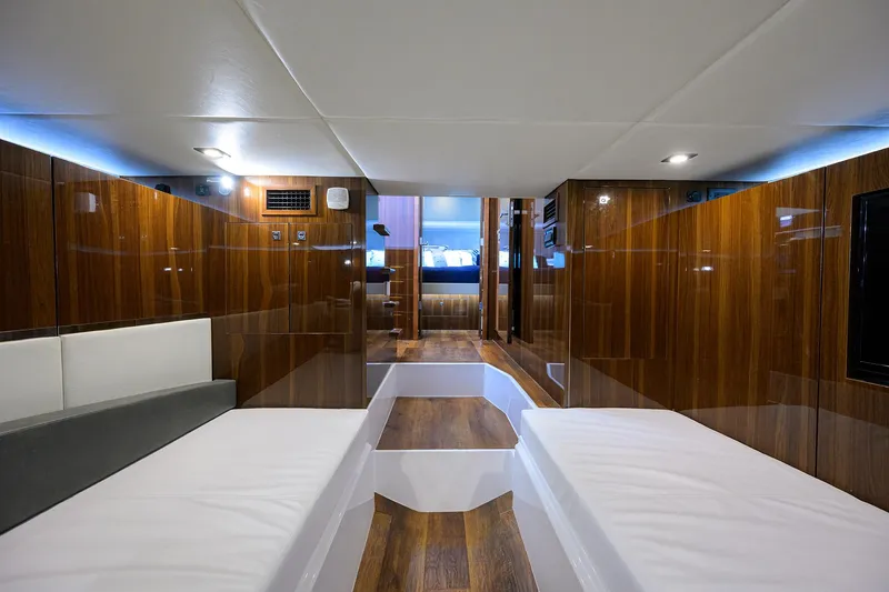 Slide: The Image of Luxurious interior of 2024 Cruisers Yachts GLS-OB with sleek wood paneling and modern design. - 31
