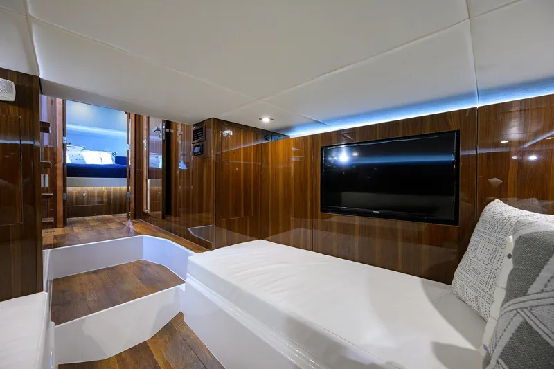 Slide: The Image of Luxurious interior of 2024 Cruisers Yachts GLS-OB with wood paneling and modern amenities. - 32
