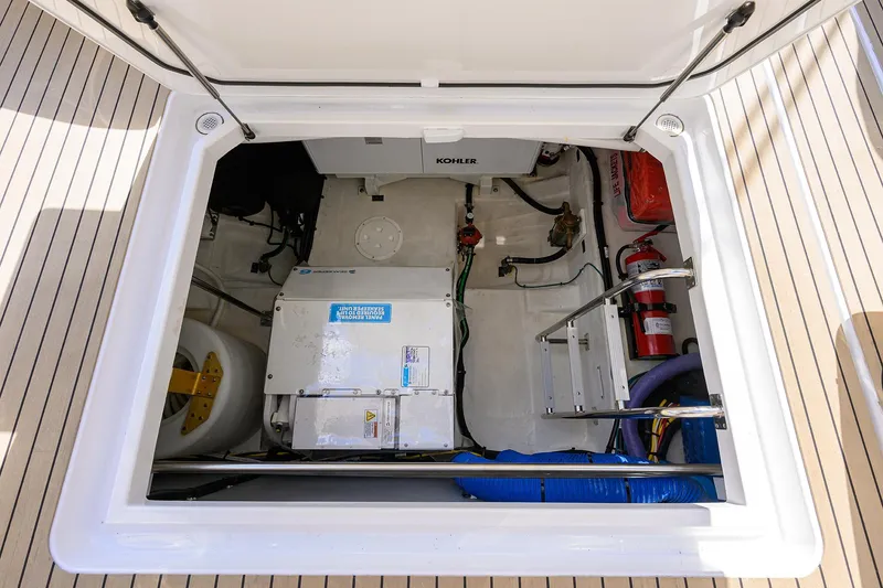 Slide: The Image of 2024 Cruisers Yachts GLS-OB engine compartment with equipment and fire extinguisher. - 37