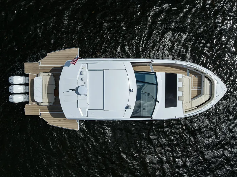 Slide: The Image of 2024 Cruisers Yachts GLS-OB, aerial view, sleek design, on water. - 47