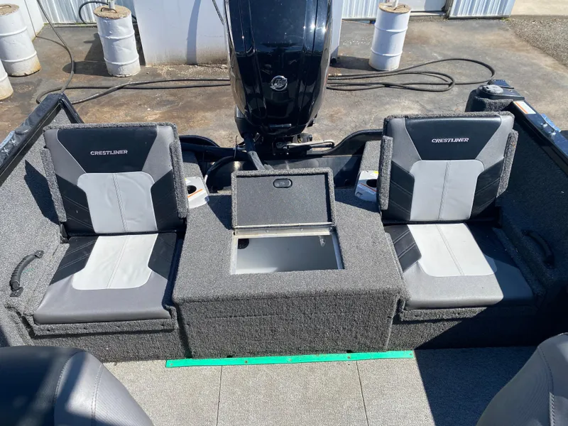 Slide: The Image of 2021 Crestliner FishHawk 1650 boat interior with two seats and storage compartment. - 3