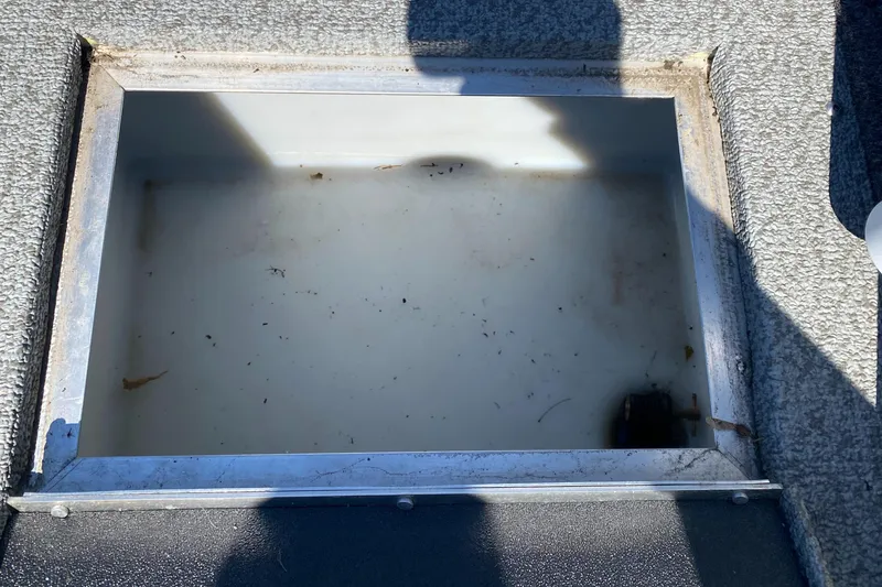 Slide: The Image of Livewell compartment in a 2021 Crestliner FishHawk 1650 boat, partially filled with water. - 5