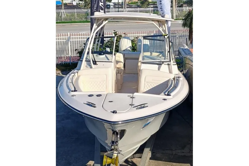 Slide: The Image of 2025 Grady-White Freedom 275 boat, sleek design, docked outdoors. - 2