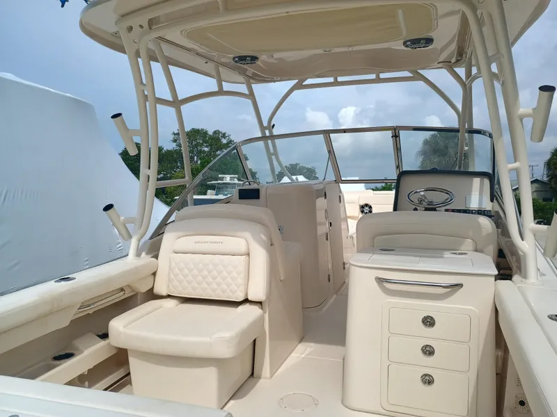 Slide: The Image of 2025 Grady-White Freedom 275 boat interior with seating and helm station. - 8