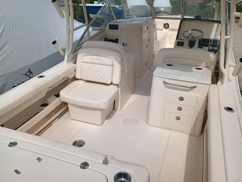 Slide: The Image of 2025 Grady-White Freedom 275 boat interior with seating and storage compartments. - 9