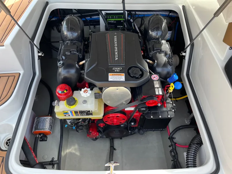Slide: The Image of Engine compartment of 2025 Crownline Eclipse E235 boat, featuring a Volvo Penta engine. - 12