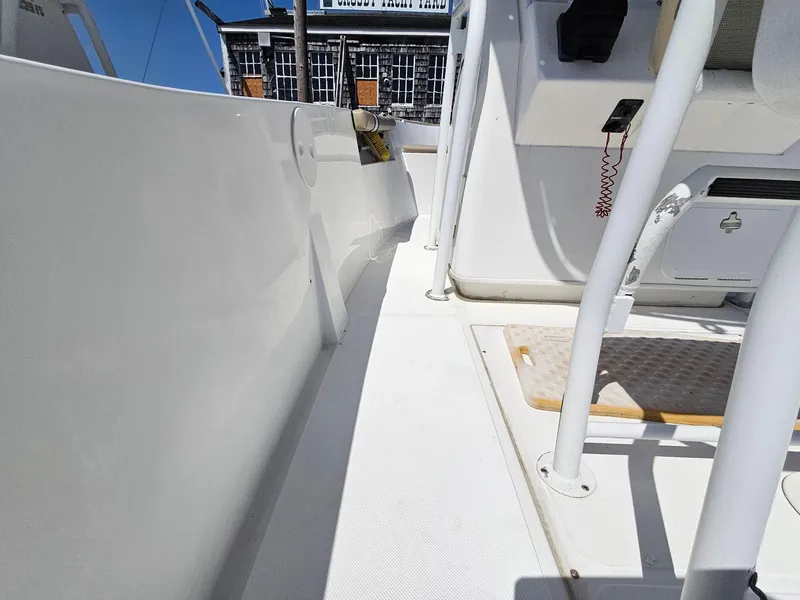 Slide: The Image of 2007 Seastrike 220 B boat interior, featuring white deck and seating area. - 10