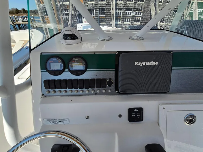 Slide: The Image of Control panel of a 2007 Seastrike 220 B boat with Raymarine equipment. - 12