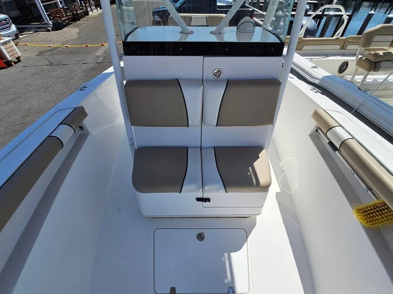 Slide: The Image of 2007 Seastrike 220 B boat interior with cushioned seating and storage compartment. - 14