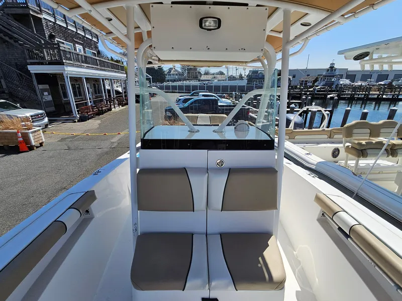 Slide: The Image of 2007 Seastrike 220 B boat interior with seating, docked at a marina. - 16