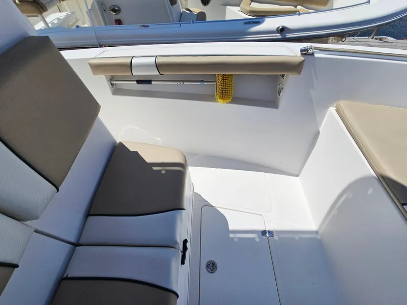 Slide: The Image of 2007 Seastrike 220 B boat interior with beige seating and storage compartment. - 19