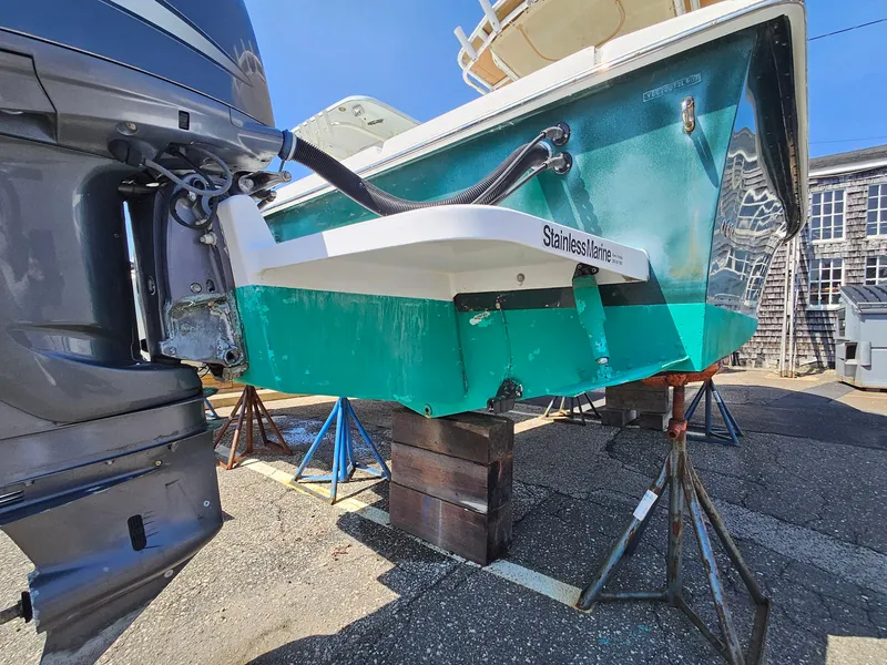 Slide: The Image of 2007 Seastrike 220 B boat on stands, showing outboard motor and hull details. - 4