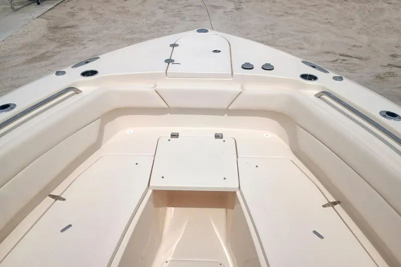 Slide: The Image of 2025 Grady-White Canyon 271 boat interior, featuring spacious seating and storage compartments. - 18