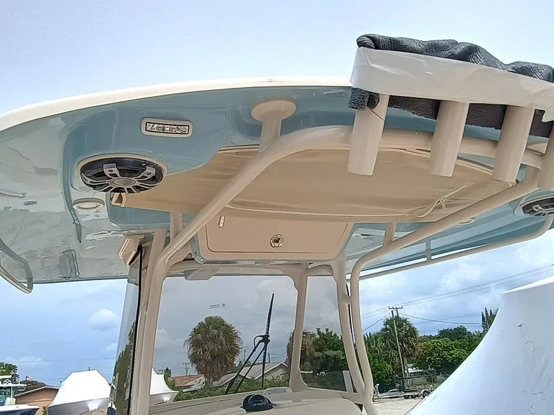 Slide: The Image of 2025 Grady-White Canyon 271 boat with overhead speakers and rod holders. - 27