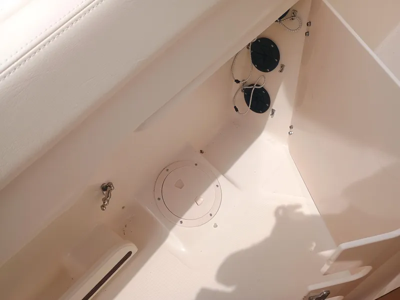 Slide: The Image of Interior view of 2025 Grady-White Canyon 271 boat, showcasing storage compartments. - 28