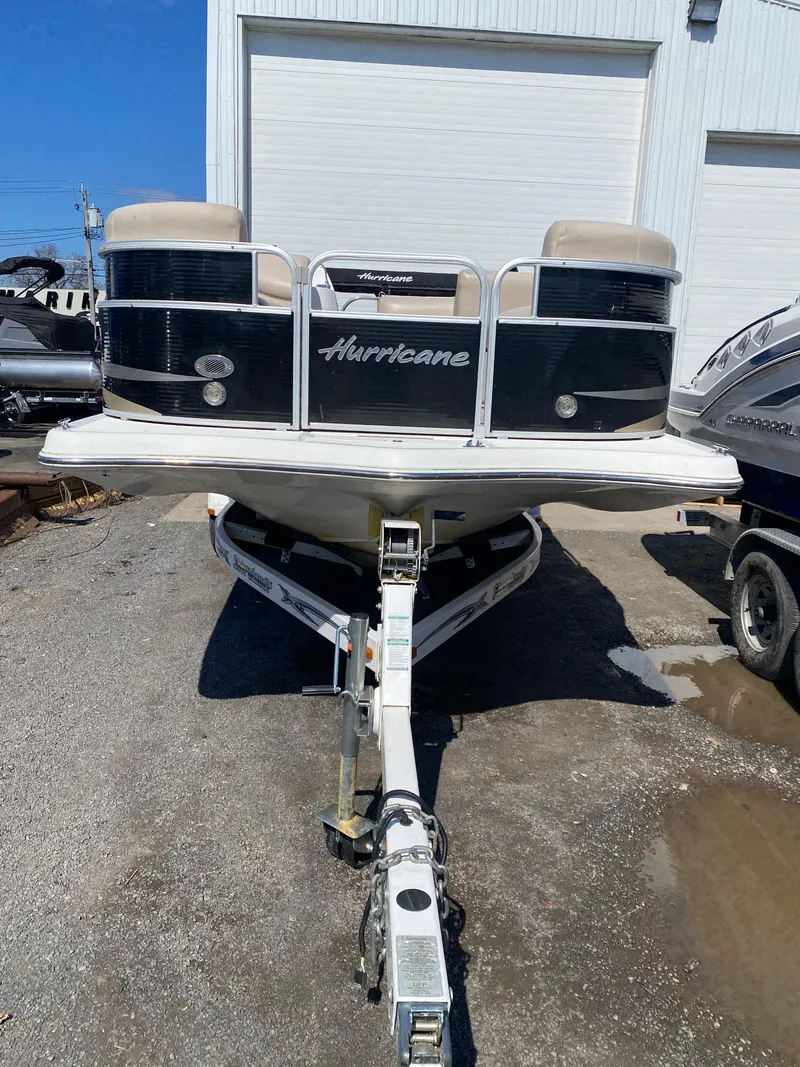 Slide: The Image of 2014 Hurricane Fundeck 216 boat on trailer, parked outdoors. - 5