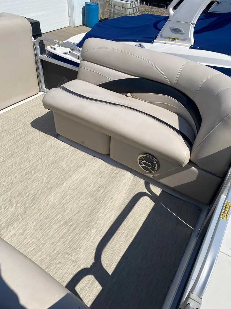 Slide: The Image of 2014 Hurricane Fundeck 216 boat interior with beige seating and carpet. - 7