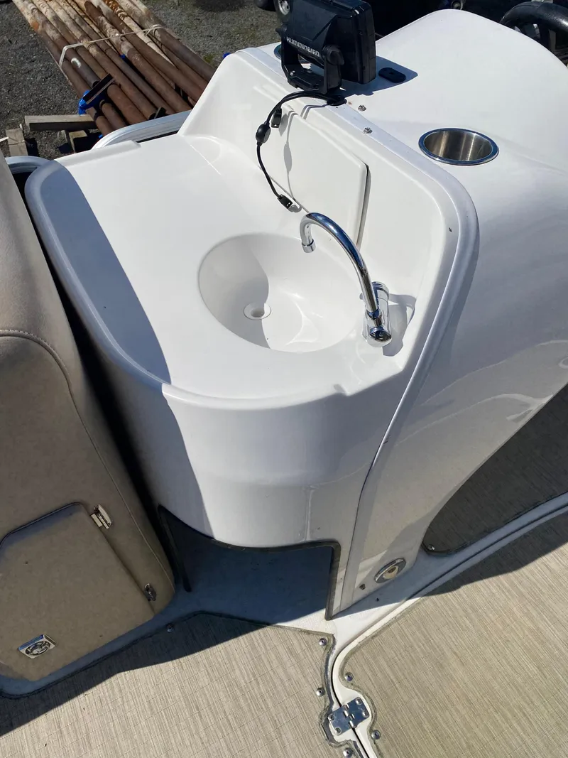 Slide: The Image of 2014 Hurricane Fundeck 216 boat sink with faucet and cup holder. - 9