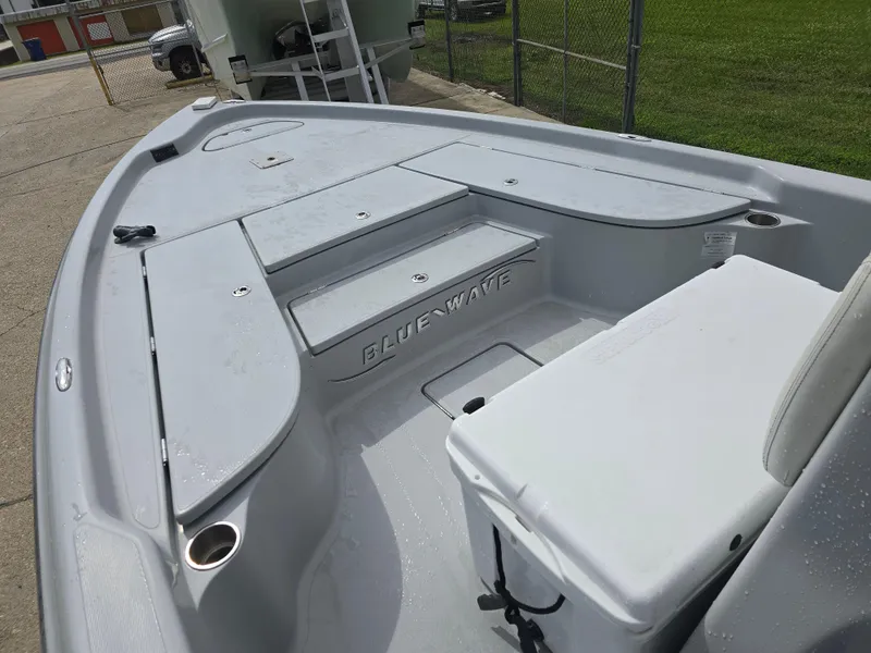 Slide: The Image of 2016 Blue Wave 2400 PureBay boat interior with seating and storage compartments. - 13