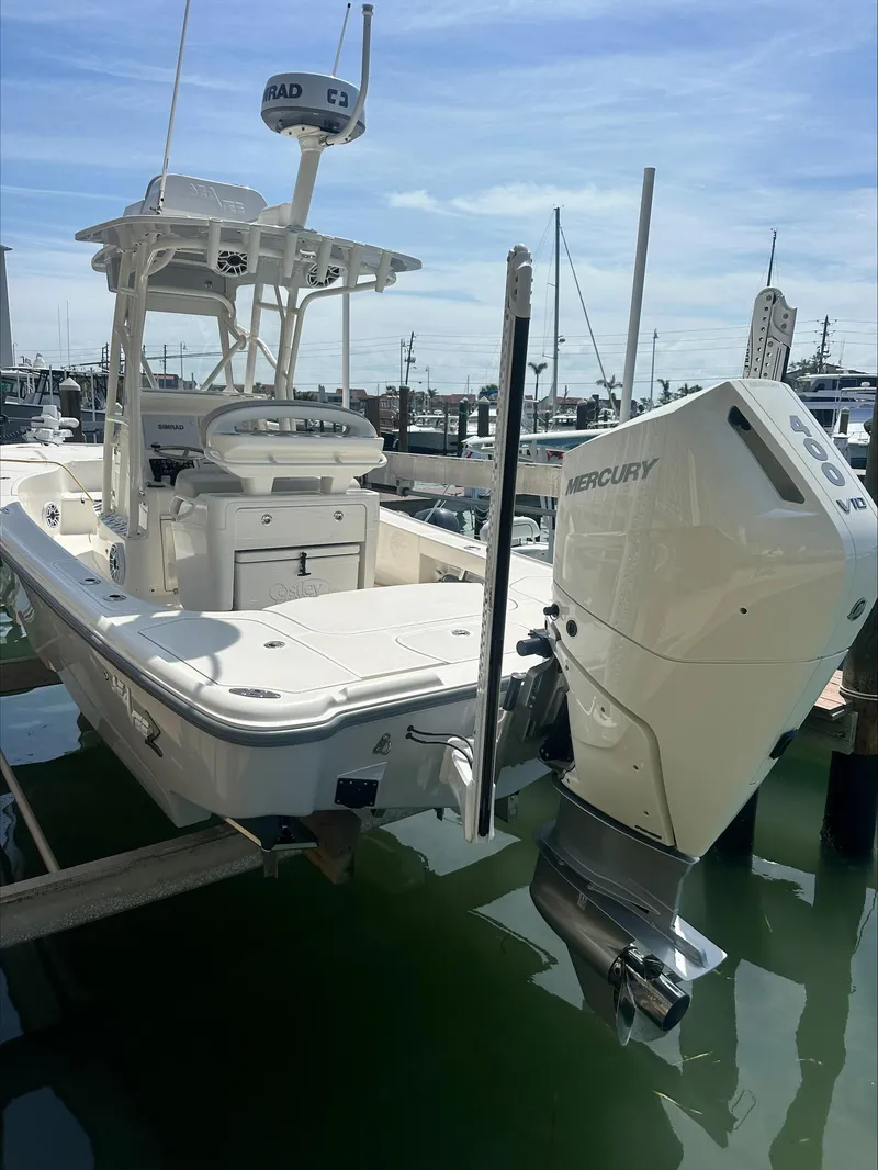 Slide: The Image of 2024 SeaVee 270Z boat with Mercury outboard motor docked in marina. - 7