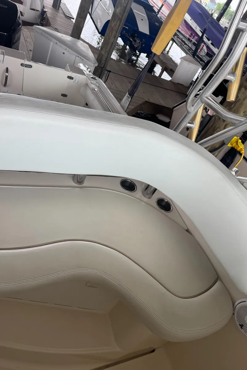 Slide: The Image of 2004 Wellcraft 290 Coastal boat interior with white seating and sleek design. - 25