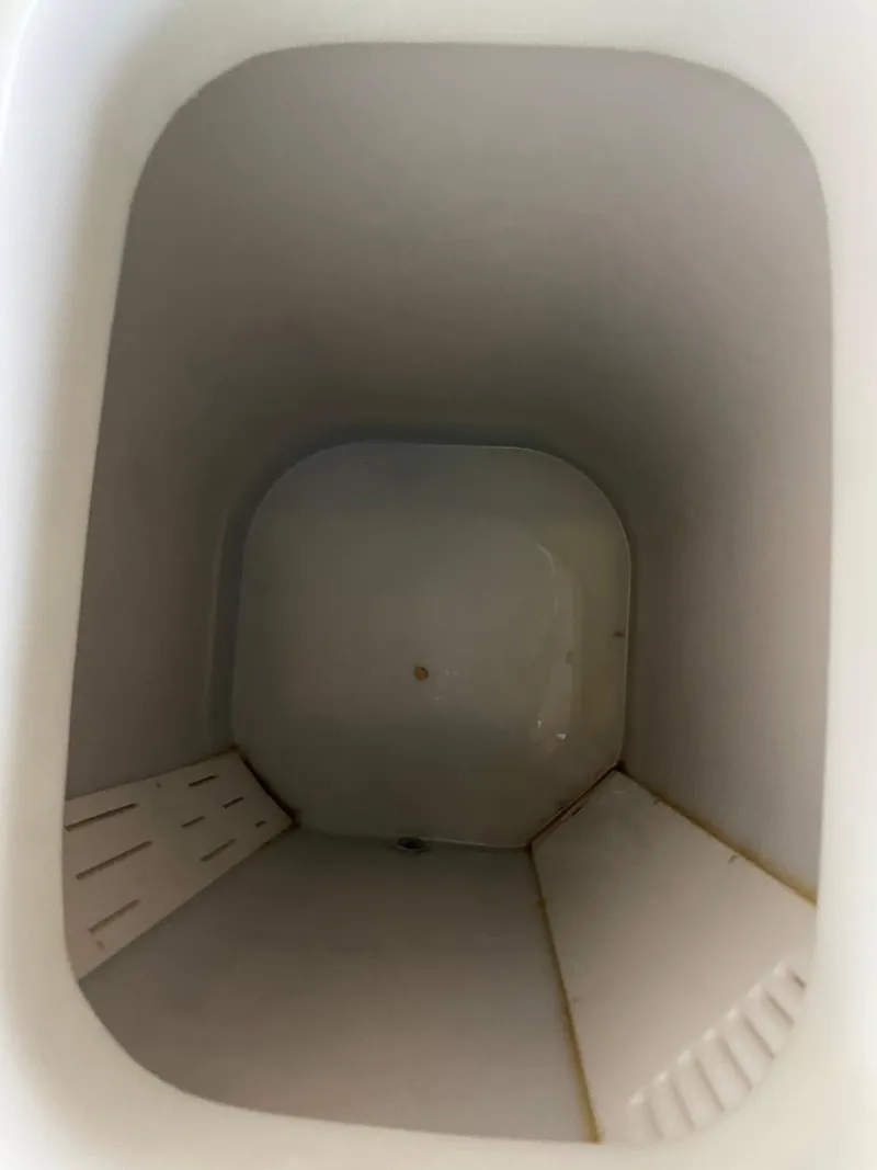 Slide: The Image of Empty storage compartment inside a 2004 Wellcraft 290 Coastal boat. - 33