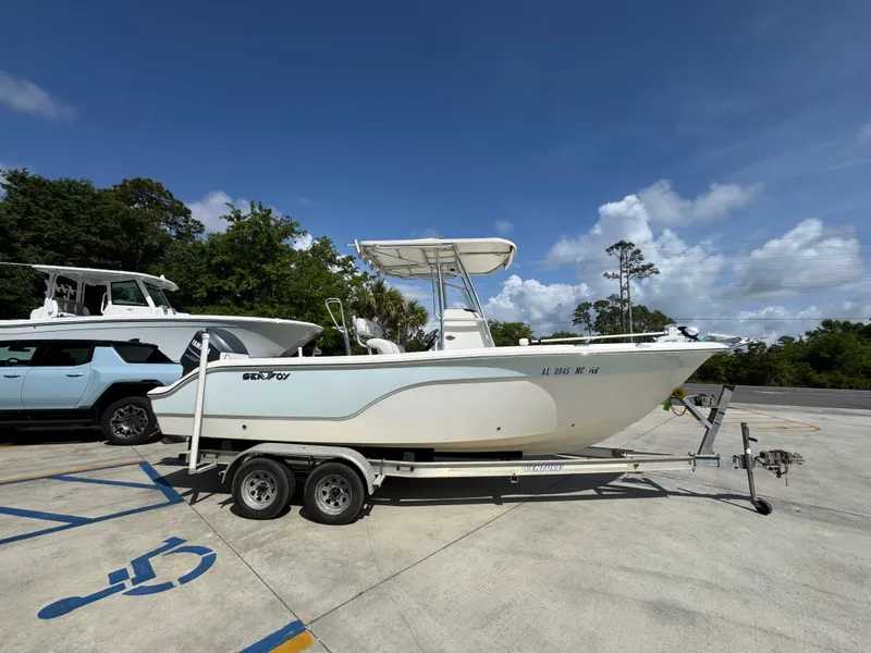 Slide: The Image of 2011 Sea Fox 236 Center Console boat on trailer in sunny parking lot. - 11
