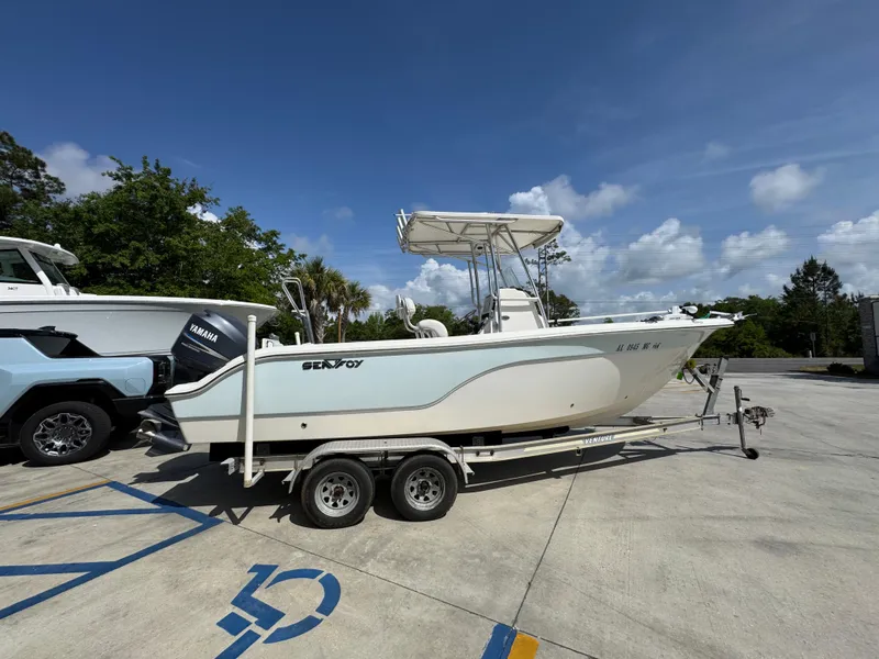 Slide: The Image of 2011 Sea Fox 236 Center Console boat on trailer in parking lot. - 12