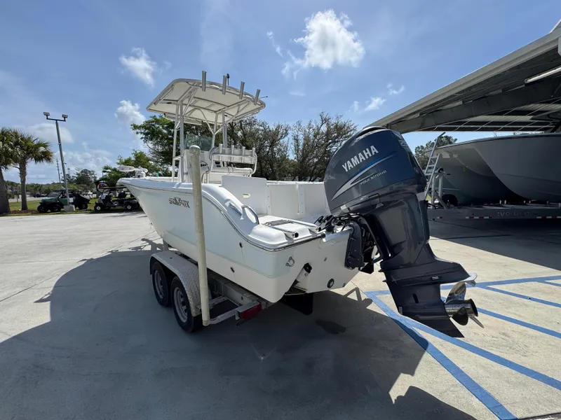 Slide: The Image of 2011 Sea Fox 236 Center Console boat with Yamaha outboard motor on a trailer. - 19