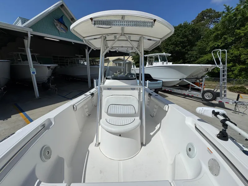 Slide: The Image of 2011 Sea Fox 236 Center Console boat with T-top, docked outdoors. - 26