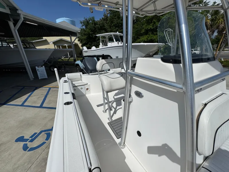 Slide: The Image of 2011 Sea Fox 236 Center Console boat with seating, parked in a marina. - 29
